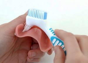 Чистка и уход за съемными зубными протезами