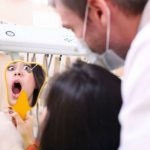 Causes of blood from under the crown of a tooth